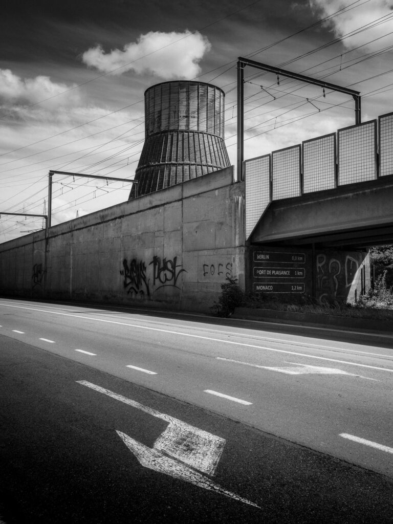 A cloud above the old cooling tower suggests a final wisp of steam